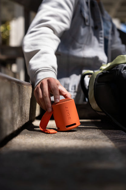 Sony SRS-XB100 Wireless Bluetooth Portable Lightweight Super-Compact Travel Speaker, Extra-Durable IP67 Waterproof & Dustproof, 16 Hour Battery, Versatile Strap, and Hands-Free Calling, Orange New 🍁 All In One Marketplace Canada