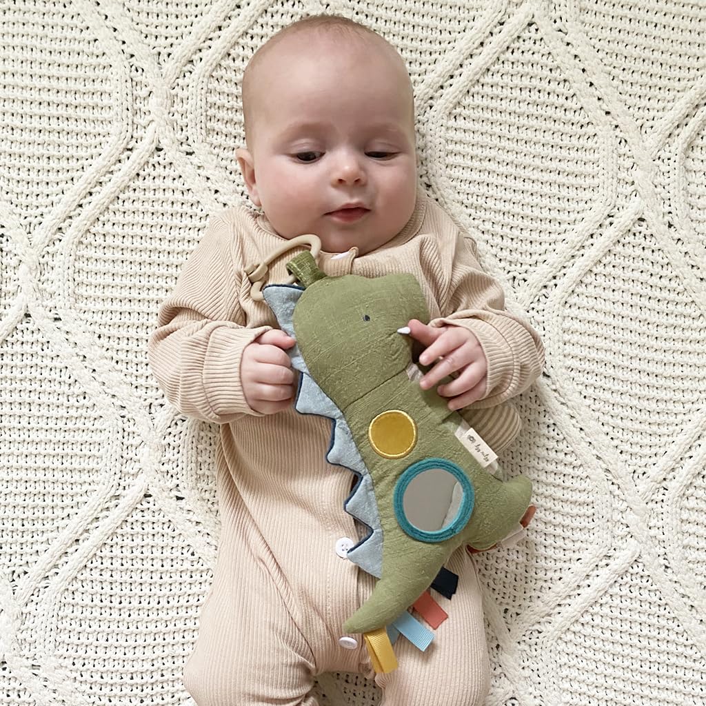 Itzy Ritzy Bitzy Traveler Car Seat & Stroller Toy for Babies – Developmental Sensory Toy Features Crinkle & Rattle Sounds & Multiple Textures –Hanging Travel Toy for On-the-Go Entertainment (Dinosaur)