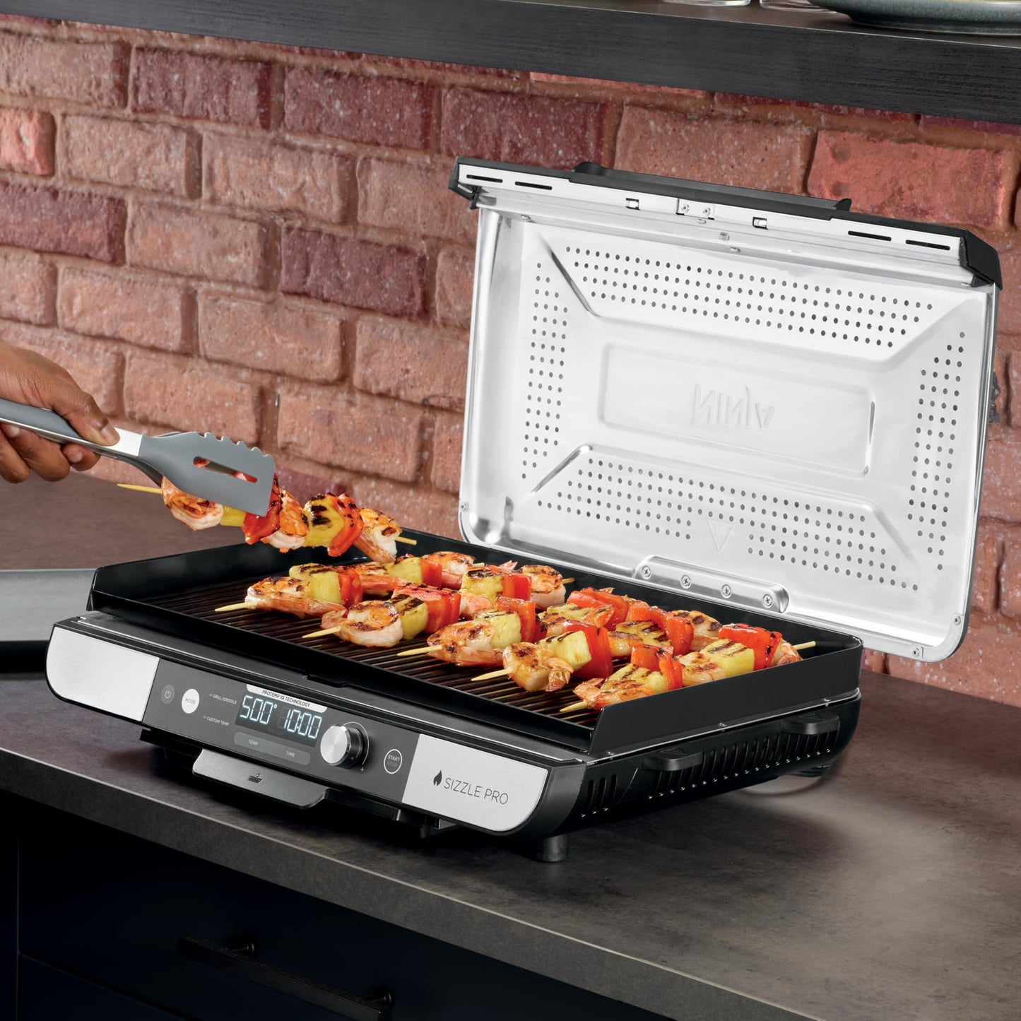 Ninja Sizzle Pro XL 20-Inch Indoor Griddle + Grill, Detachable Ventilated Lid, Grease Control, Ceramic Nonstick Plates, Even Edge-to-Edge Cooking, Extra Large Capacity, Versatile, Silver, GX101C - Available at All In One Marketplace Canada