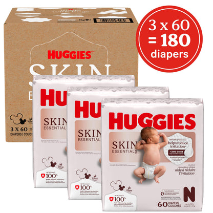 Huggies Size Newborn Diapers, Skin Essentials Baby Diapers, Size Newborn (6-9 lbs), 180 Count (3 Packs of 60), Packaging May Vary