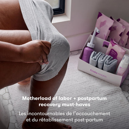 Frida Mom 15pc Labor, Delivery, & Postpartum Kit Gift Set for Baby Showers & Mom to Be, Includes Peri Bottle, Nursing Gown, Disposable Underwear, Ice Maxi Pads, Pad Liners, Perineal Foam, Socks & Toiletry Bag Frida