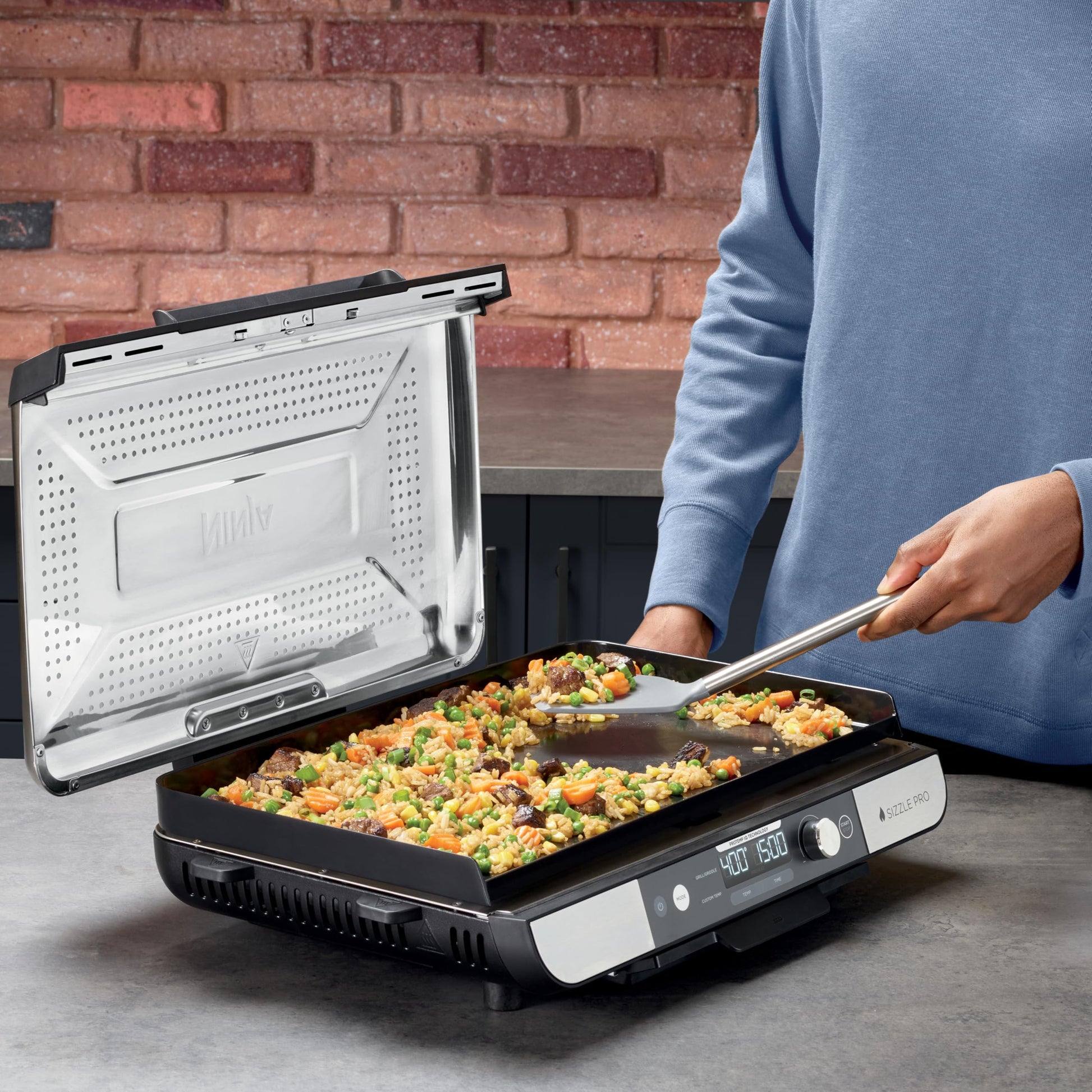 Ninja Sizzle Pro XL 20-Inch Indoor Griddle + Grill, Detachable Ventilated Lid, Grease Control, Ceramic Nonstick Plates, Even Edge-to-Edge Cooking, Extra Large Capacity, Versatile, Silver, GX101C - Available at All In One Marketplace Canada
